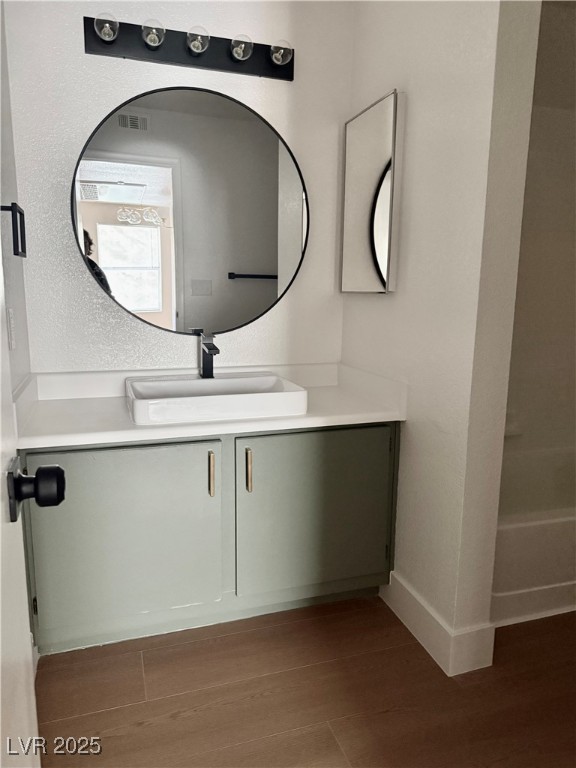 1150 North Buffalo Drive, Unit 2025 Las Vegas, NV 89128 - Photo 7 of 20 Bathroom with vanity and wood finished floors