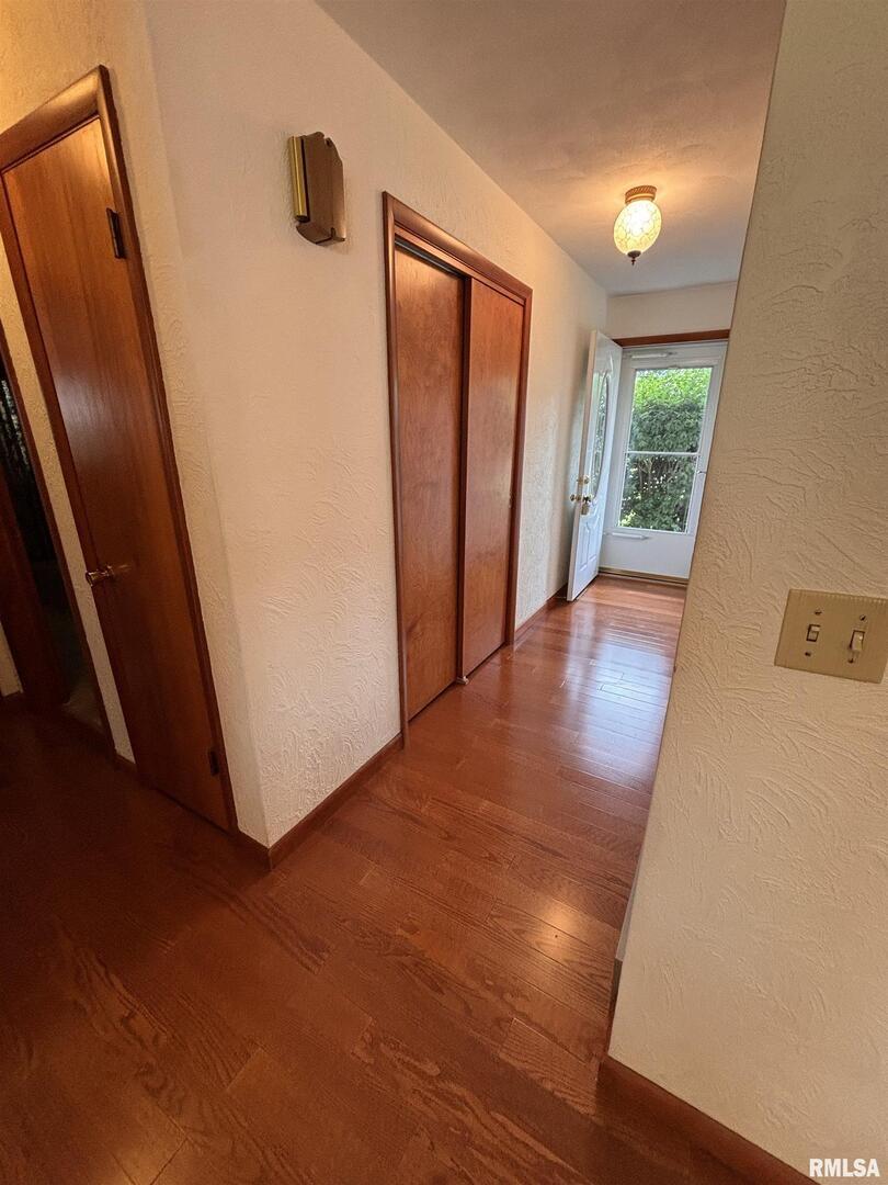 630 Mission Drive Kewanee, IL 61443 - Photo 13 of 57 wooden floor in an empty room with a window