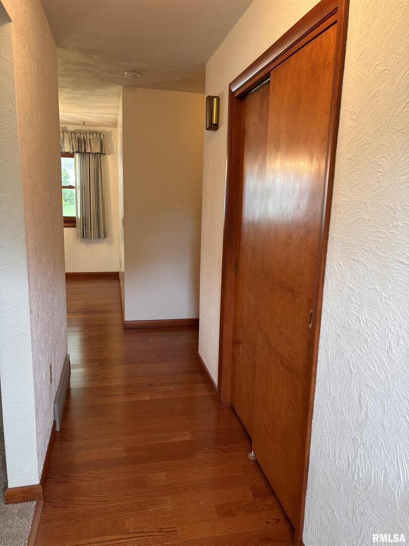 630 Mission Drive Kewanee, IL 61443 - Photo 14 of 57 a view of a hallway with wooden floor