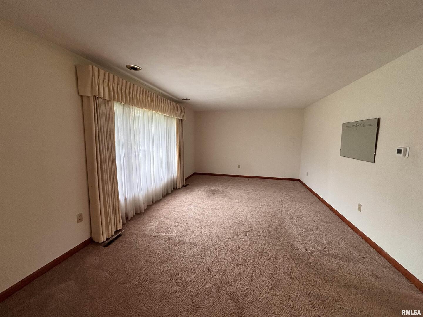 630 Mission Drive Kewanee, IL 61443 - Photo 16 of 57 an empty room with a empty space and windows