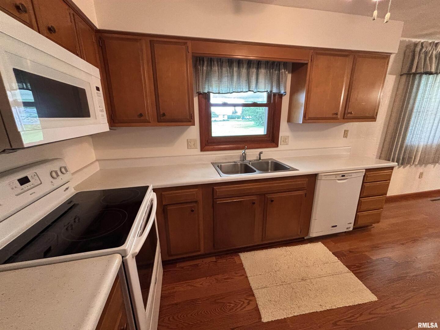 630 Mission Drive Kewanee, IL 61443 - Photo 21 of 57 a kitchen with stainless steel appliances a stove a microwave a sink and a refrigerator
