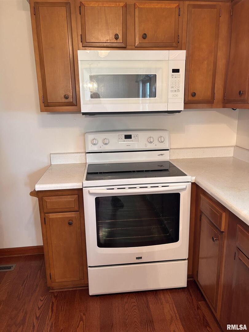 630 Mission Drive Kewanee, IL 61443 - Photo 23 of 57 a kitchen with cabinets and white appliances