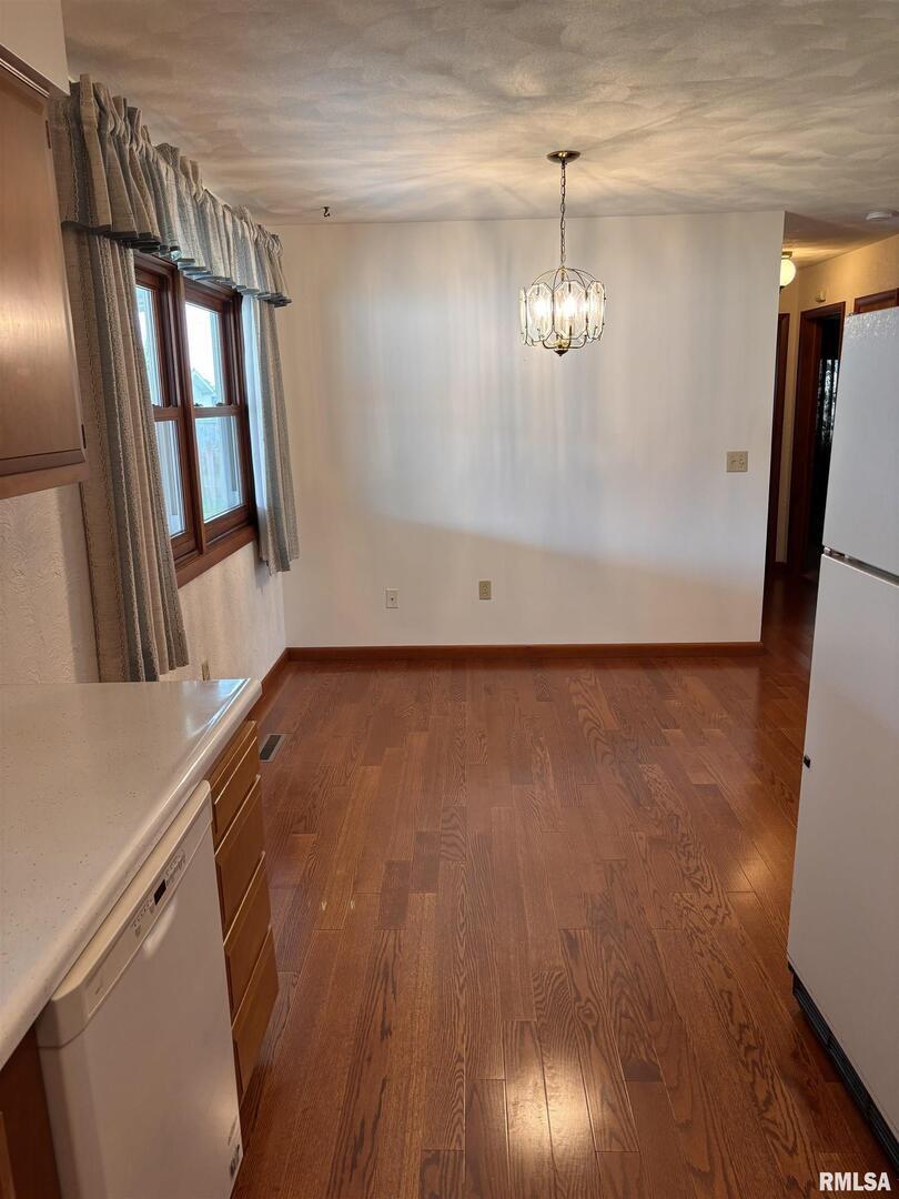 630 Mission Drive Kewanee, IL 61443 - Photo 27 of 57 a view of empty room with wooden floor and fan