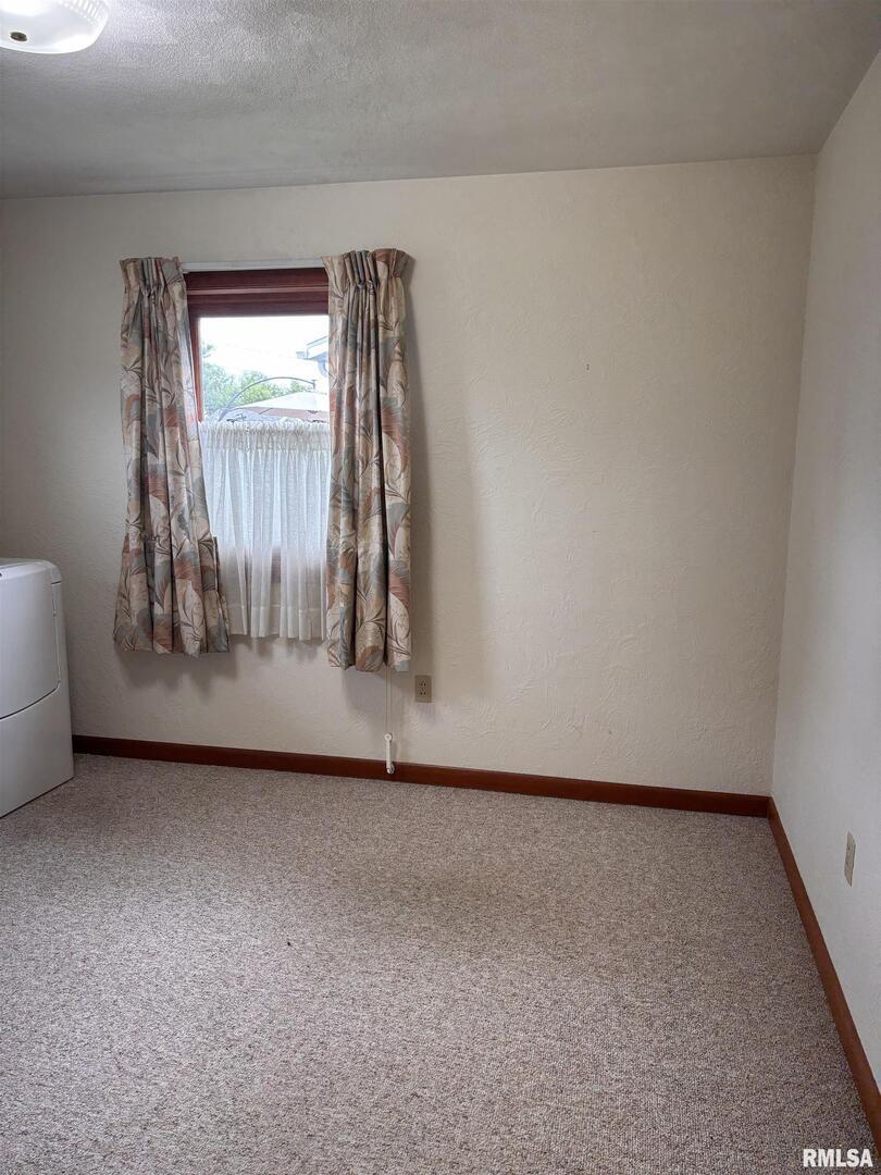 630 Mission Drive Kewanee, IL 61443 - Photo 37 of 57 an empty room with wooden floor and windows