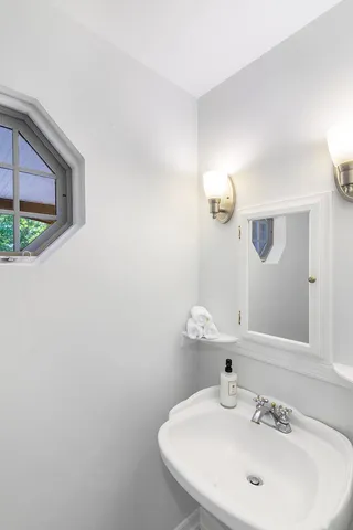 a bathroom with a sink and a mirror