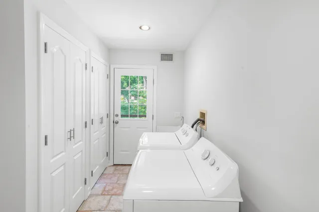 a en suite bathroom with a sink and shower curtain