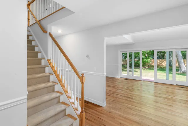 a view of an entryway with wooden floor