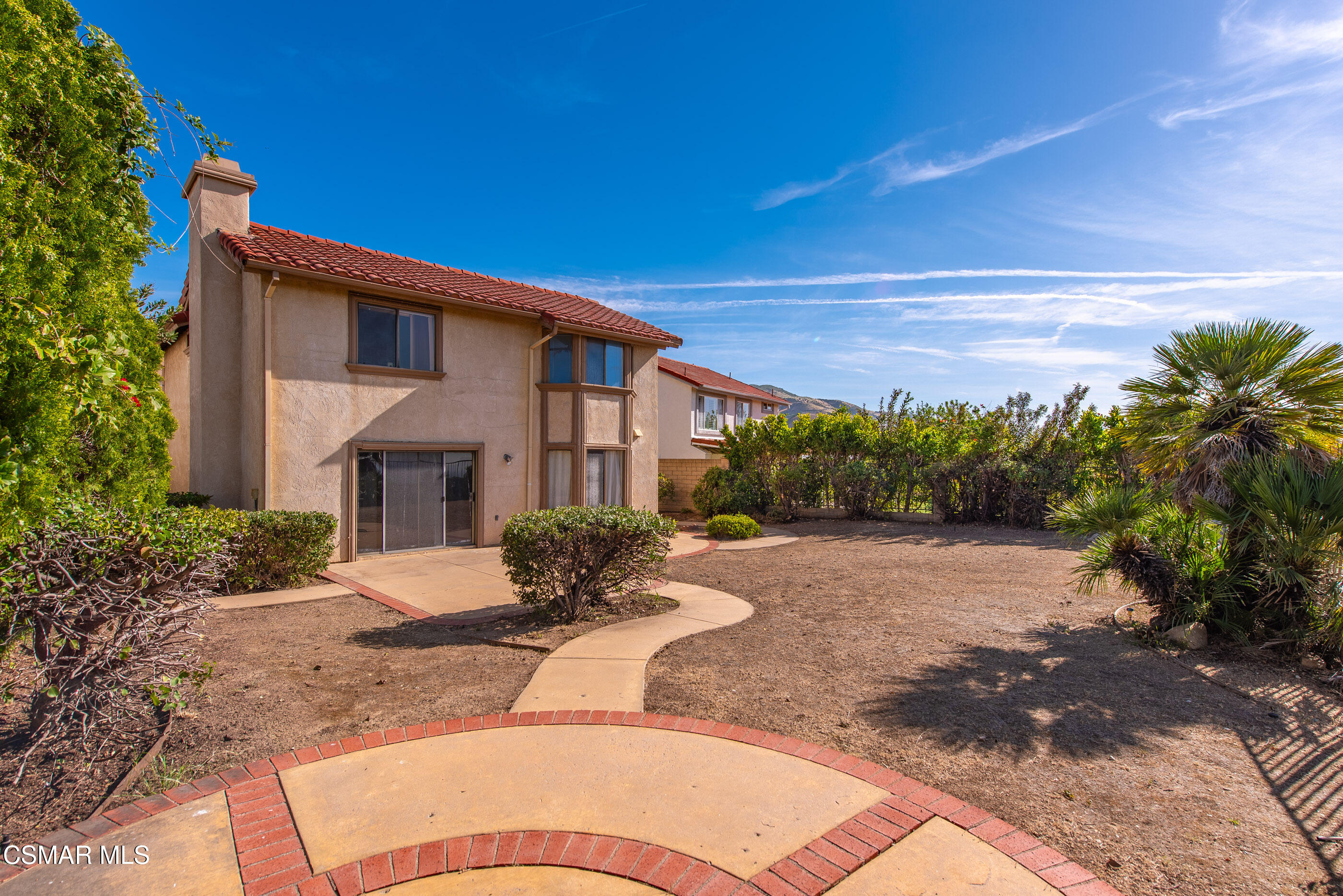 12036 Shadow Ridge Way Porter Ranch, CA 91326 - Photo 13 of 35 a front view of a house with garden