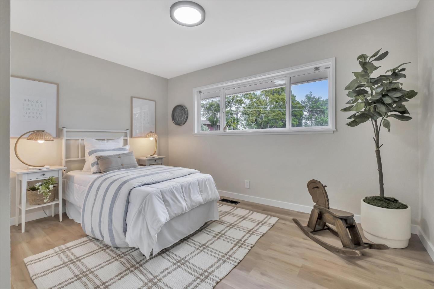 3400 Haas Drive Aptos, CA 95003 - Photo 17 of 35 a bedroom with a bed and a potted plant