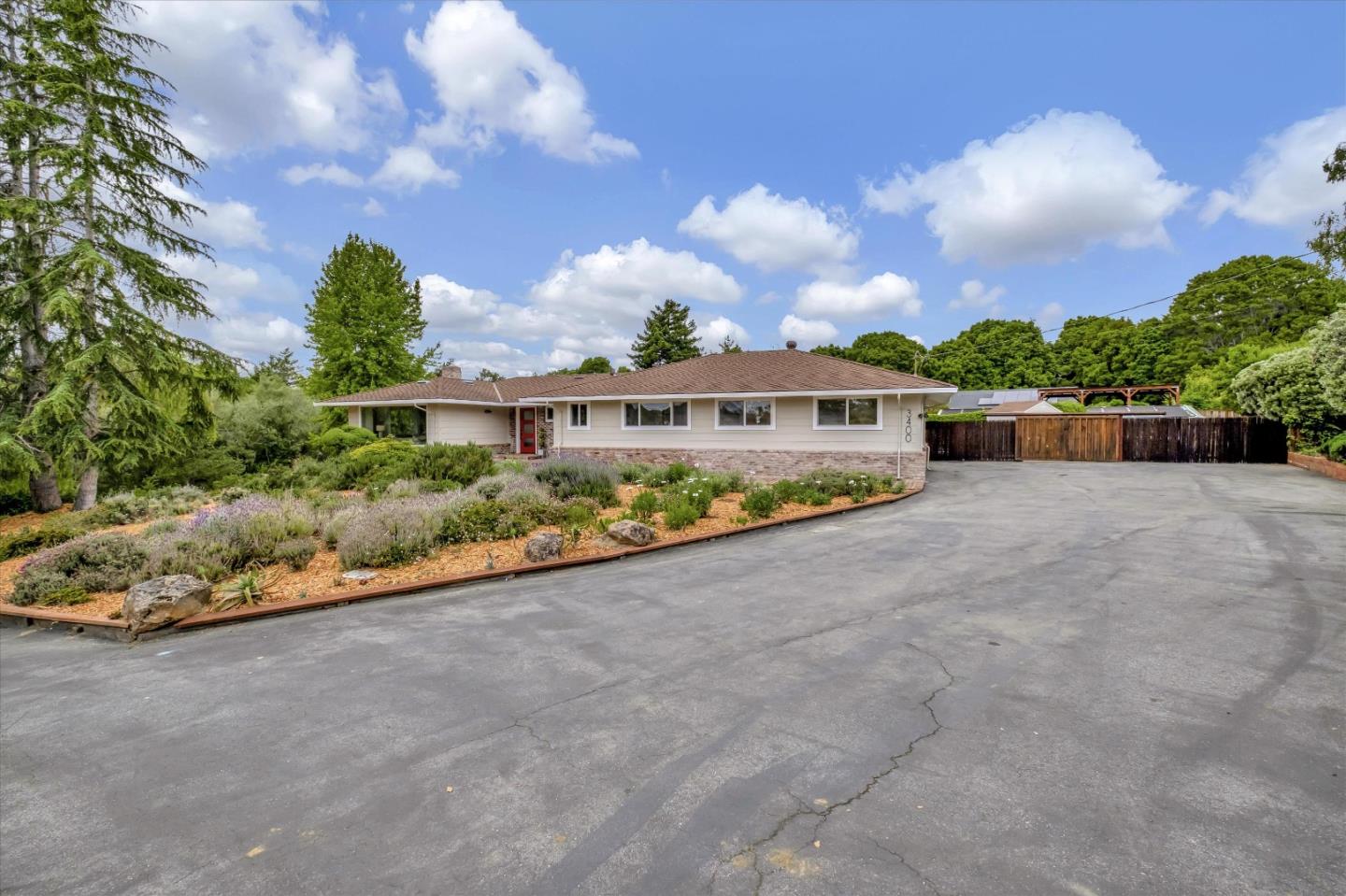 3400 Haas Drive Aptos, CA 95003 - Photo 2 of 35 a view of a house with a yard and a large tree