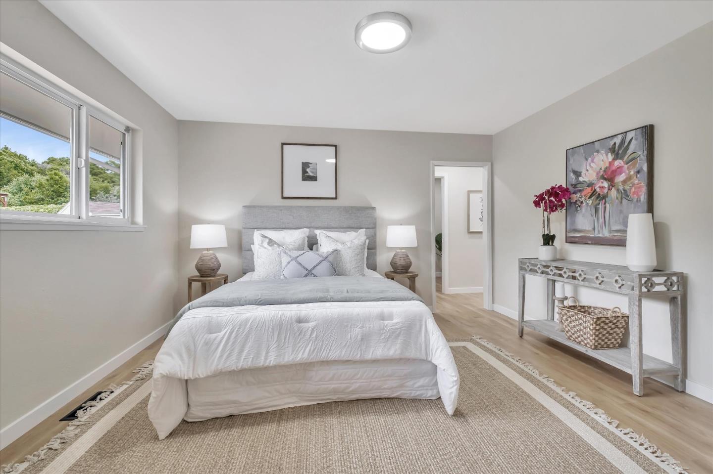 3400 Haas Drive Aptos, CA 95003 - Photo 22 of 35 a bedroom with a bed and a painting on the wall