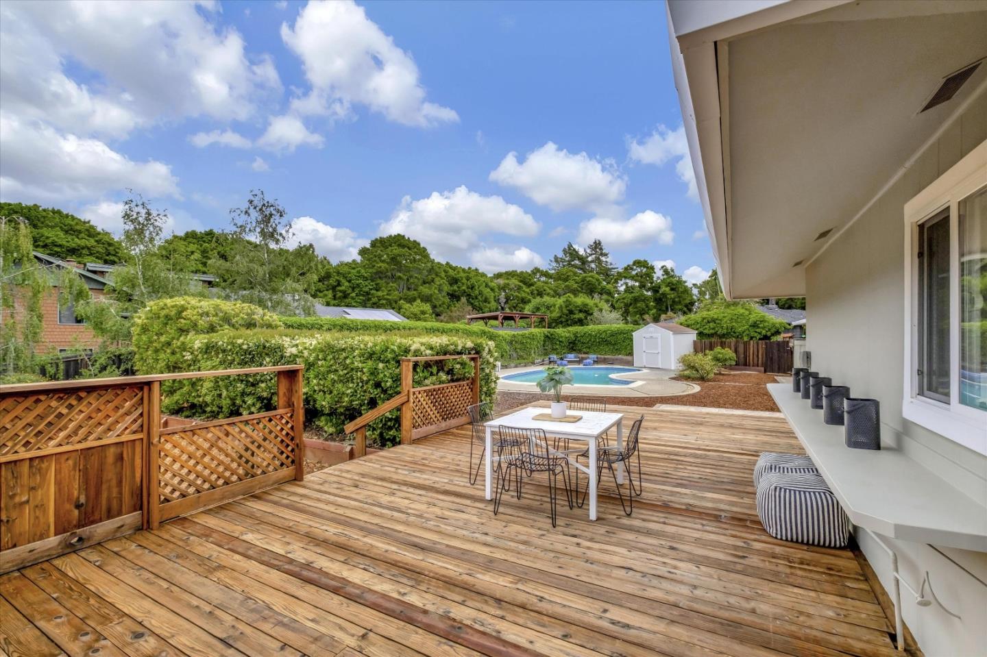 3400 Haas Drive Aptos, CA 95003 - Photo 28 of 35 a view of a chairs and table on the wooden deck