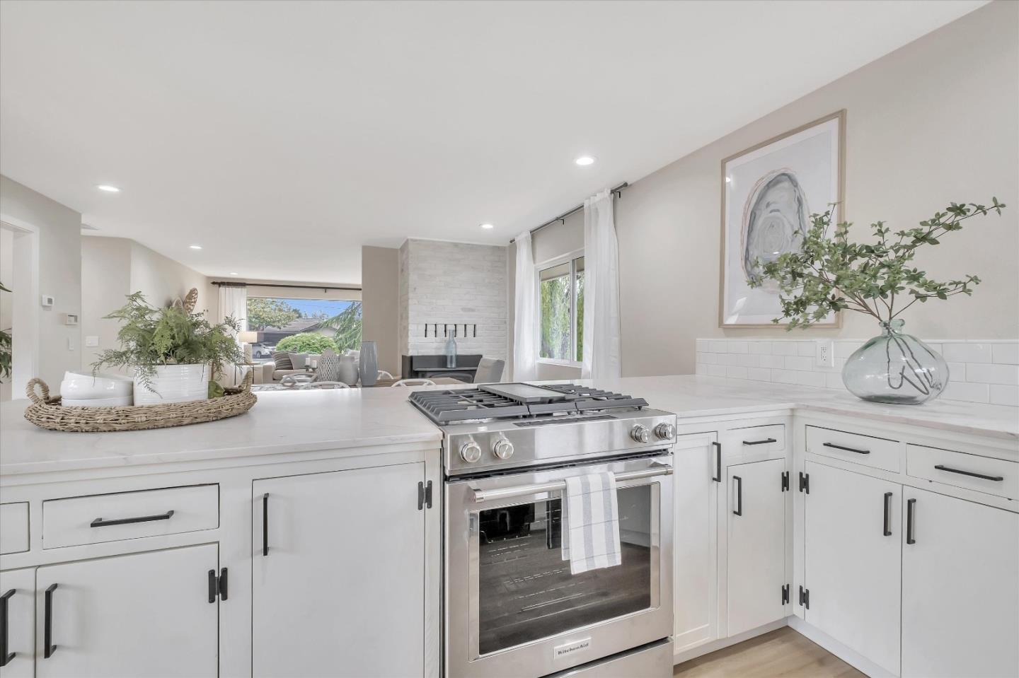 3400 Haas Drive Aptos, CA 95003 - Photo 10 of 35 a kitchen with stainless steel appliances granite countertop white cabinets and a potted plant