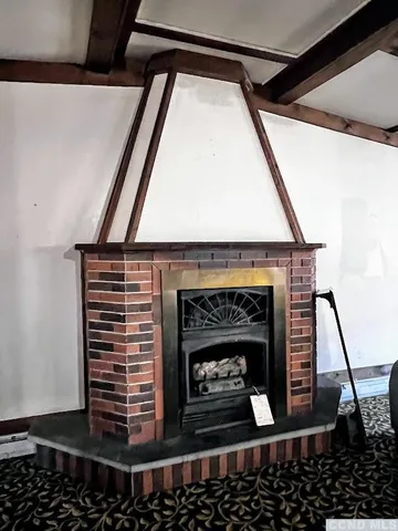 a living room with fireplace