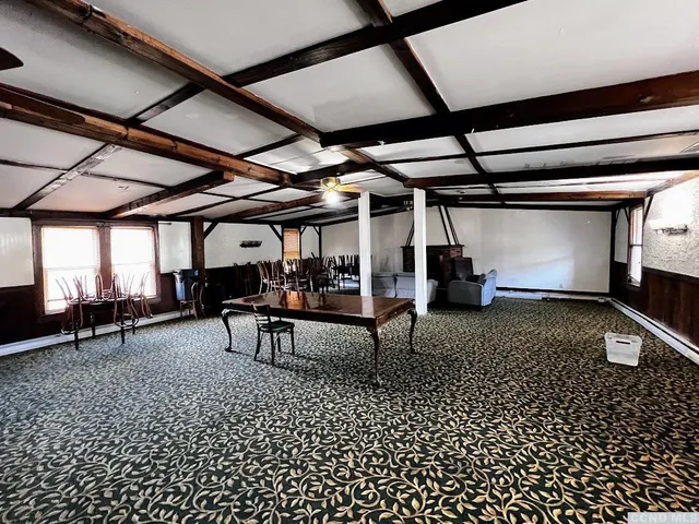 a view of a chairs and table in a room
