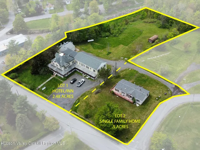 a view of a pool in a backyard