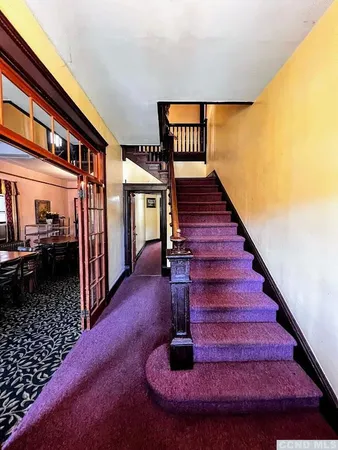 a view of entryway livingroom and hall