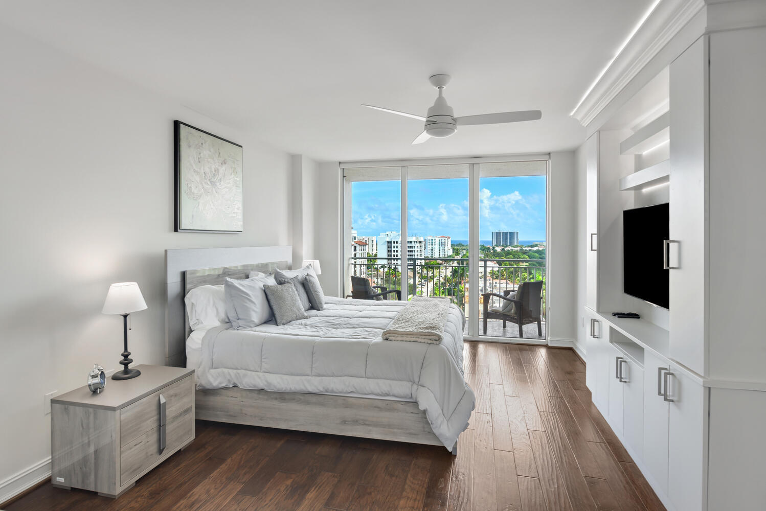 99 Southeast Mizner Boulevard, Unit PH 909 Boca Raton, FL 33432 - Photo 15 of 51 a bedroom with a bed and a flat screen tv