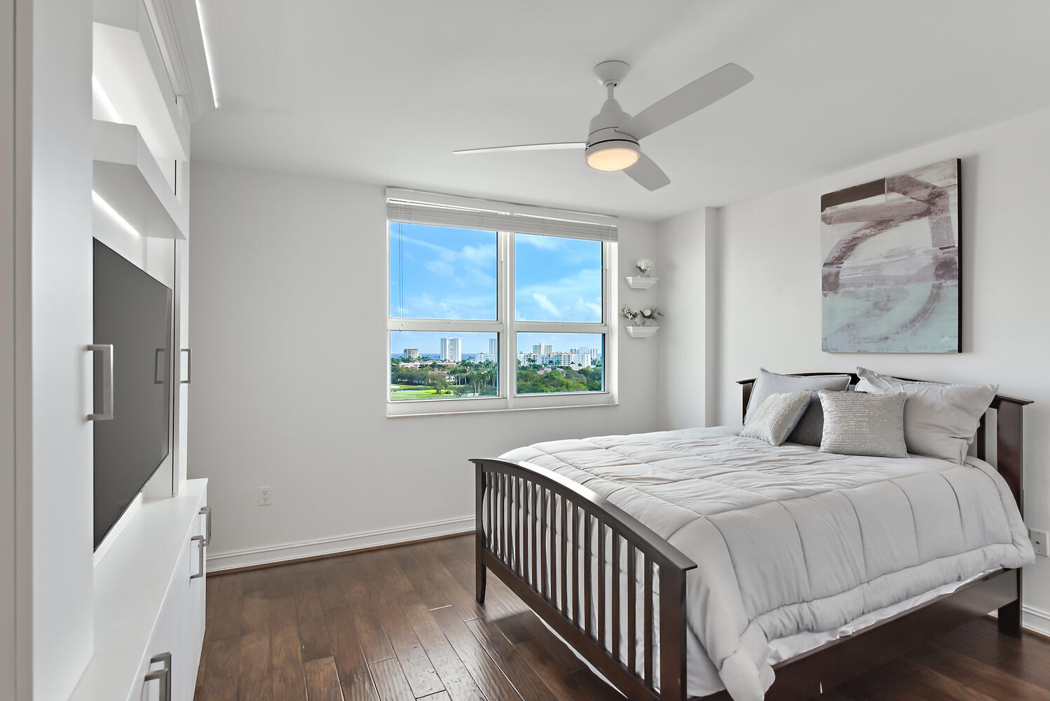 99 Southeast Mizner Boulevard, Unit PH 909 Boca Raton, FL 33432 - Photo 20 of 51 a bedroom with a bed and a large window