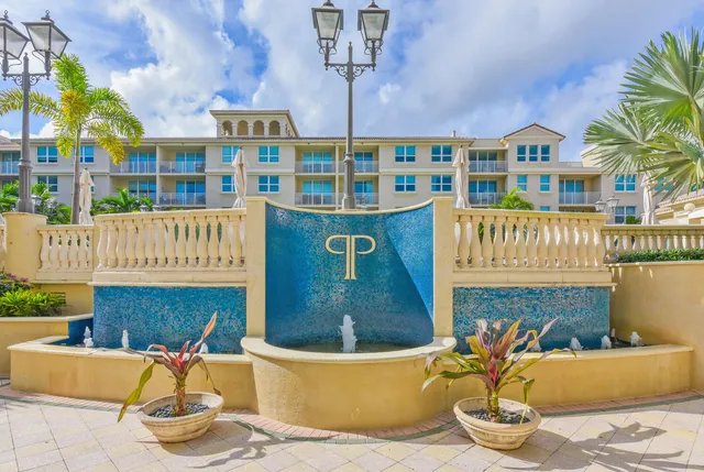 a front view of a building with outdoor seating