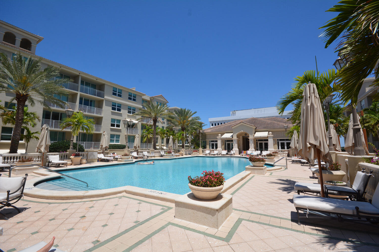 99 Southeast Mizner Boulevard, Unit PH 909 Boca Raton, FL 33432 - Photo 24 of 51 a view of a swimming pool with chairs