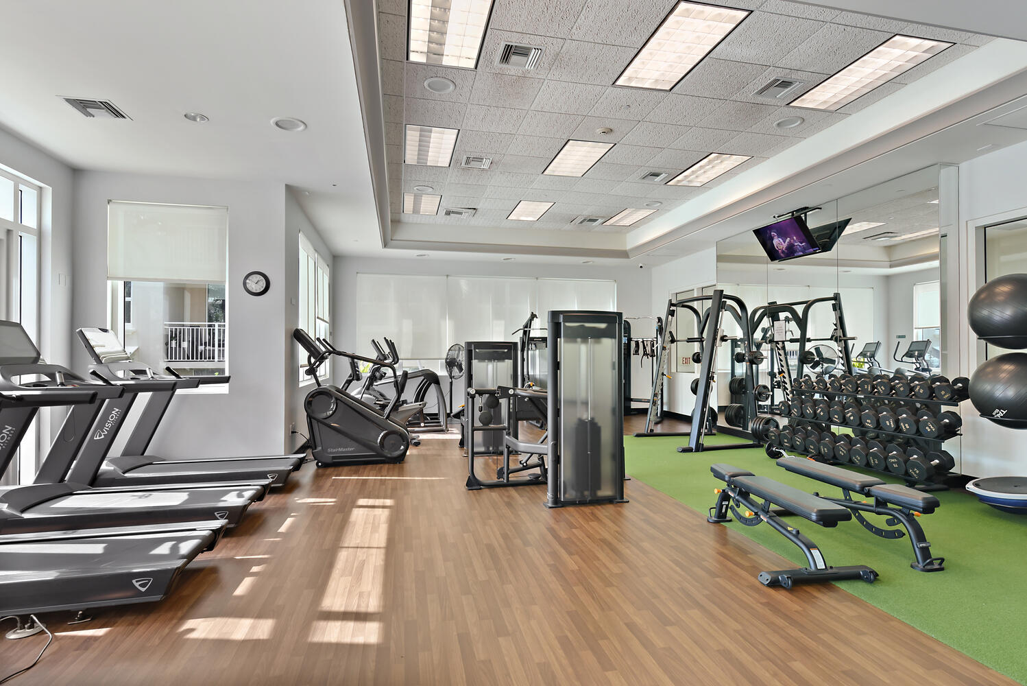 99 Southeast Mizner Boulevard, Unit PH 909 Boca Raton, FL 33432 - Photo 28 of 51 a view of a room with gym equipment