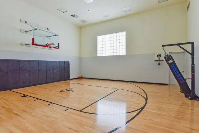 a view of a room with wooden floor and stairs