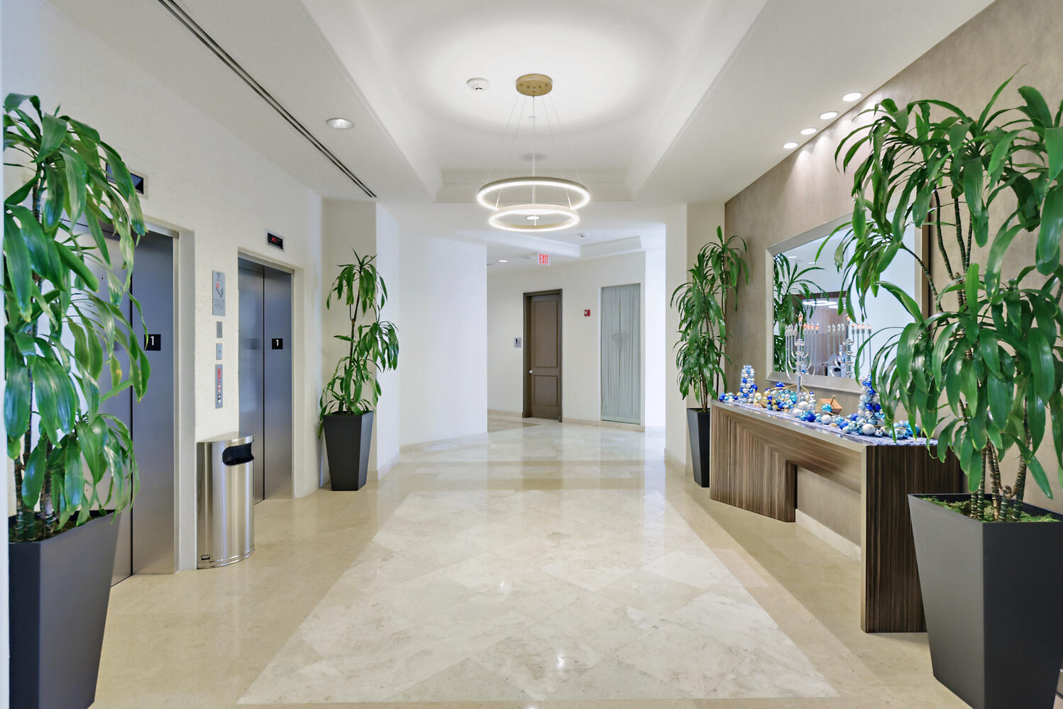 99 Southeast Mizner Boulevard, Unit PH 909 Boca Raton, FL 33432 - Photo 32 of 51 a view of entryway with potted plants