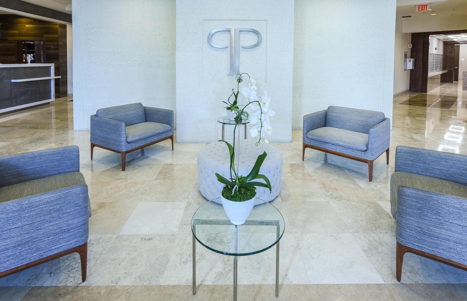 99 Southeast Mizner Boulevard, Unit PH 909 Boca Raton, FL 33432 - Photo 33 of 51 a living room with furniture and a potted plant