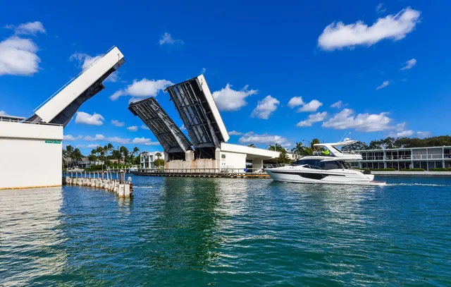 a view of a patio with a table chairs couches a table and chairs under an umbrella