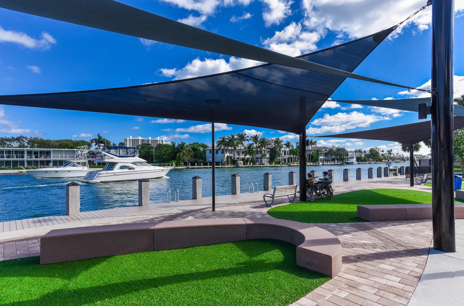 99 Southeast Mizner Boulevard, Unit PH 909 Boca Raton, FL 33432 - Photo 43 of 51 a view of a patio with a table chairs couches a table and chairs under an umbrella