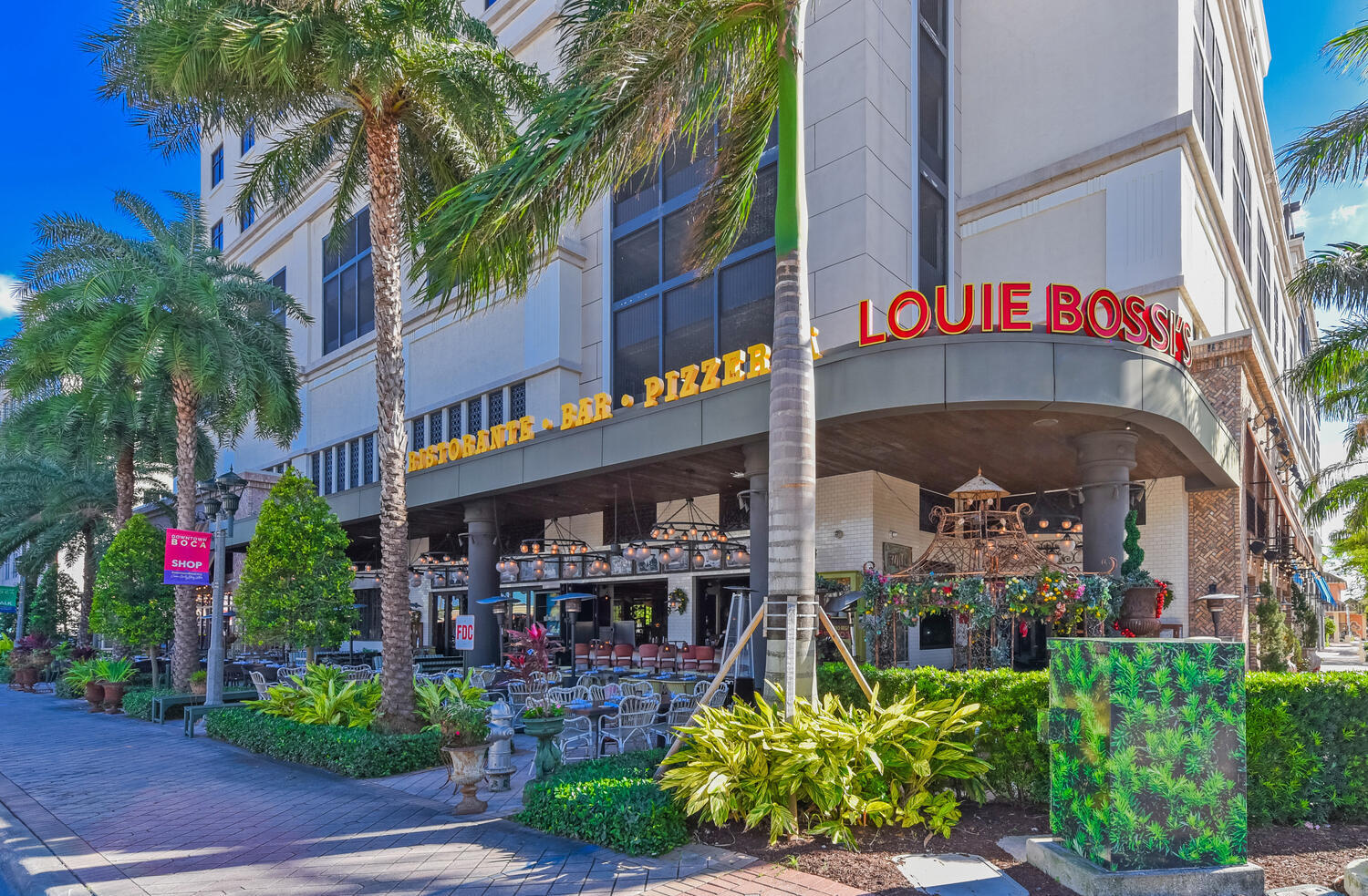 99 Southeast Mizner Boulevard, Unit PH 909 Boca Raton, FL 33432 - Photo 49 of 51 a variety of fruits and vegetables with building in the background