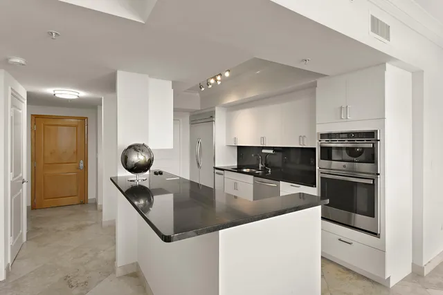 a kitchen with a stove and a sink