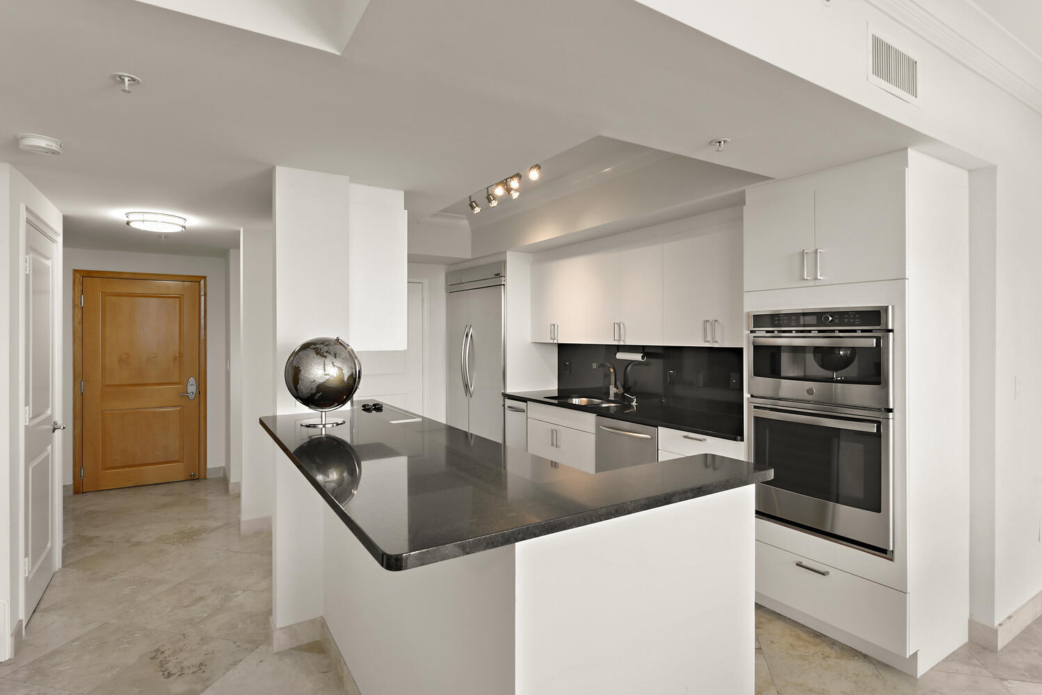 99 Southeast Mizner Boulevard, Unit PH 909 Boca Raton, FL 33432 - Photo 6 of 51 a kitchen with a stove and a sink