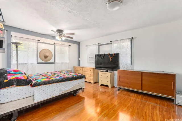 a bedroom with a bed and a lamp on a table