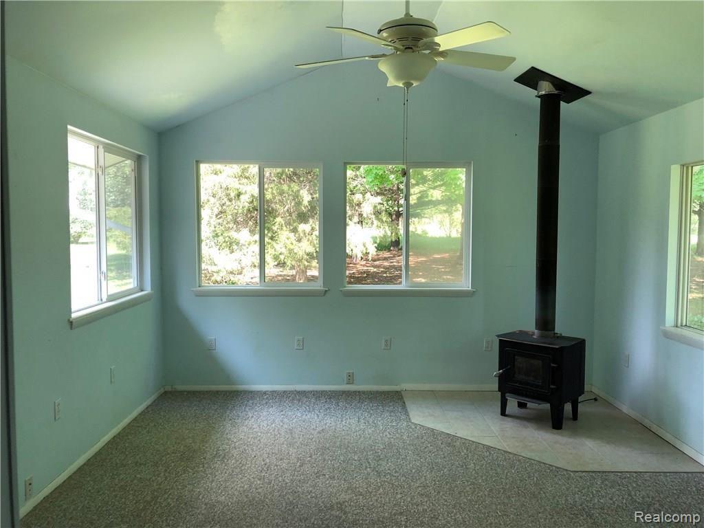 7333 Linden Road Fenton, MI 48430 - Photo 9 of 23 Wood Burner in Sun Room!