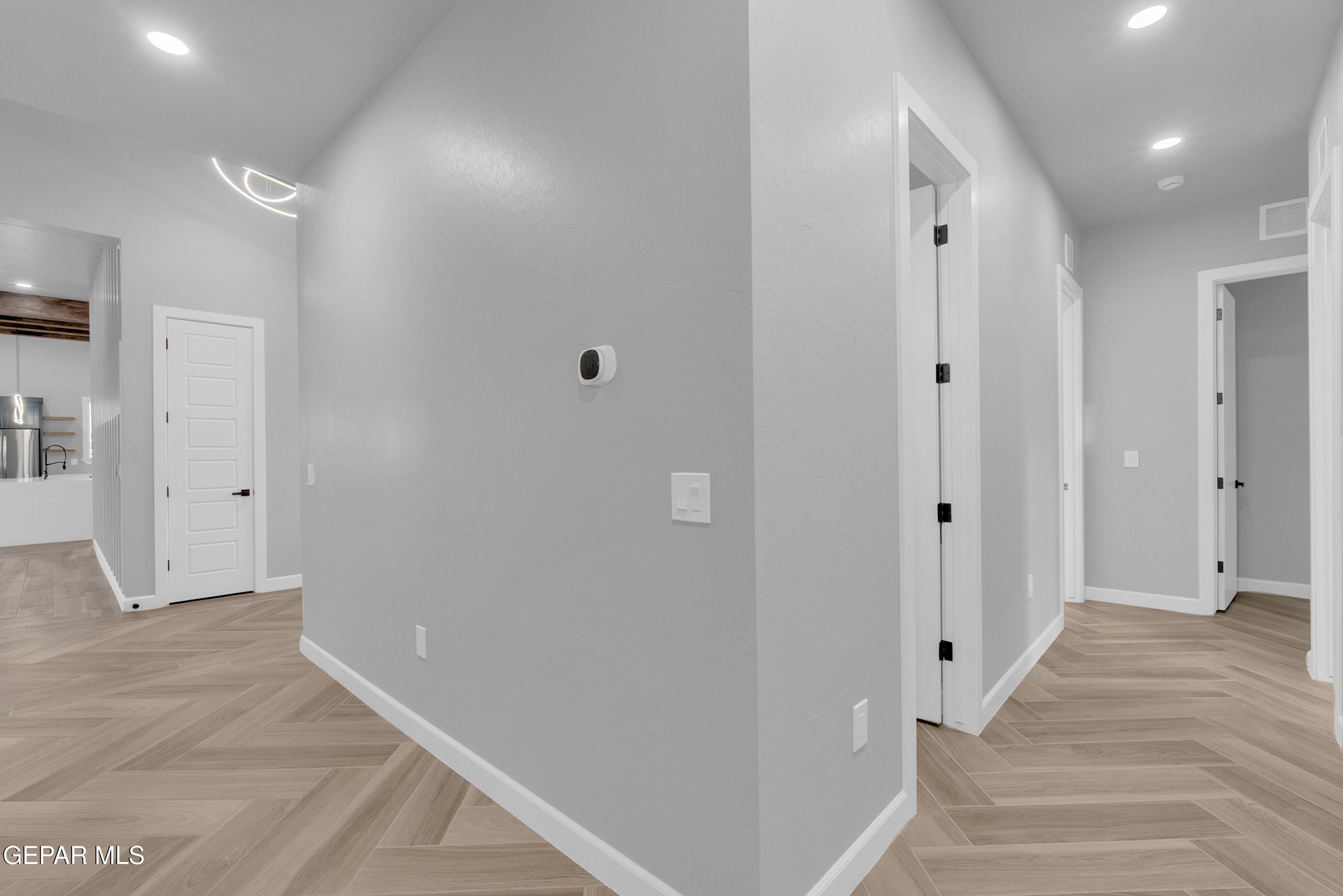 5612 Rio Bonito Circle El Paso, TX 79932 - Photo 35 of 79 a view of a hallway with wooden floor and staircase