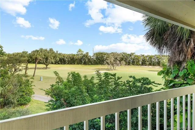 a view of lake with green space