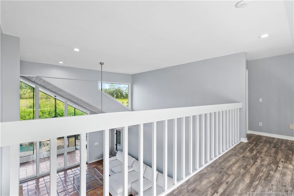 6323 Southeast Farmington Place Stuart, FL 34997 - Photo 25 of 46 Cat walk between 2nd floor guest rooms