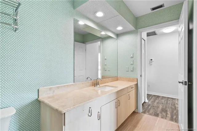 a bed room with a bed and a chair