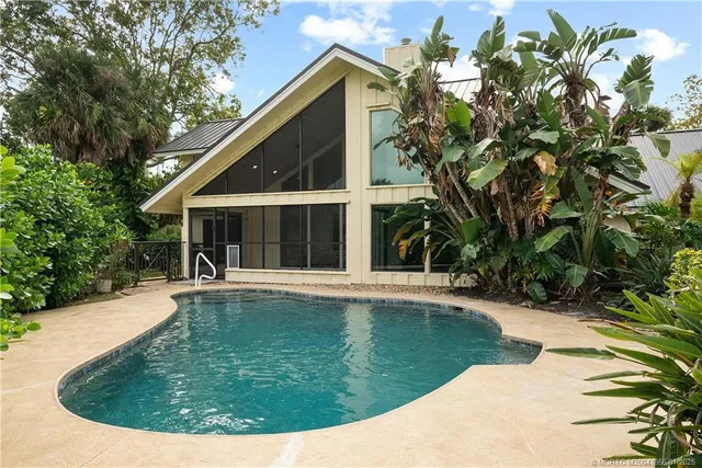a green field with lots of trees