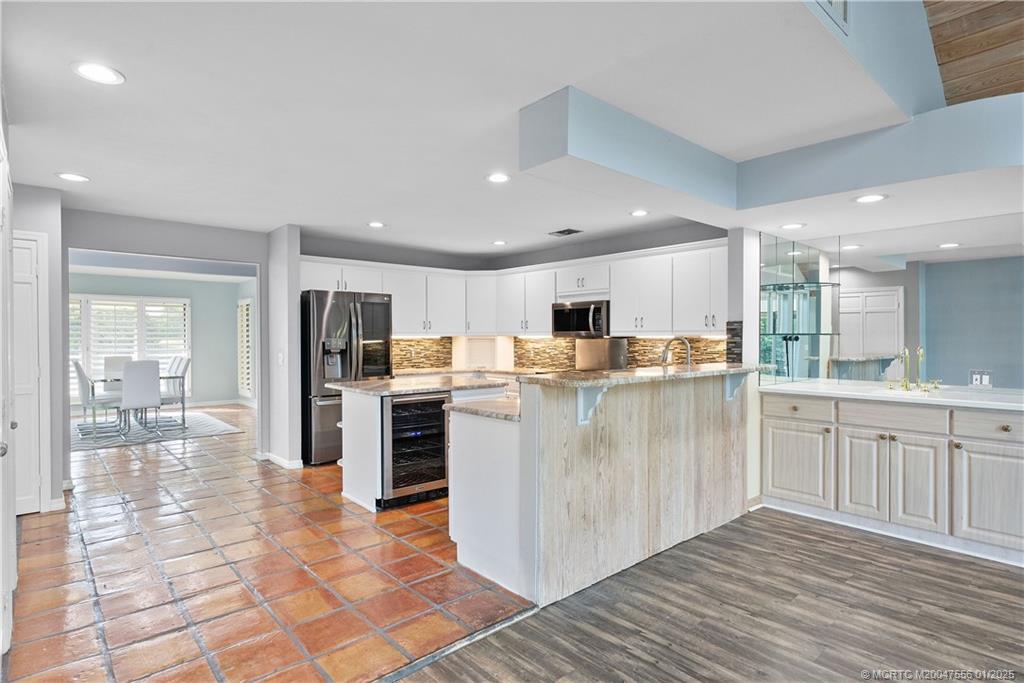 6323 Southeast Farmington Place Stuart, FL 34997 - Photo 10 of 46 Kitchen opens to family room