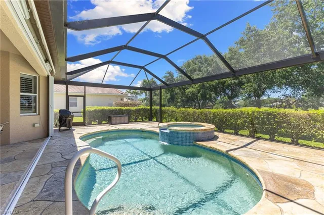 a view of a swimming pool with a patio