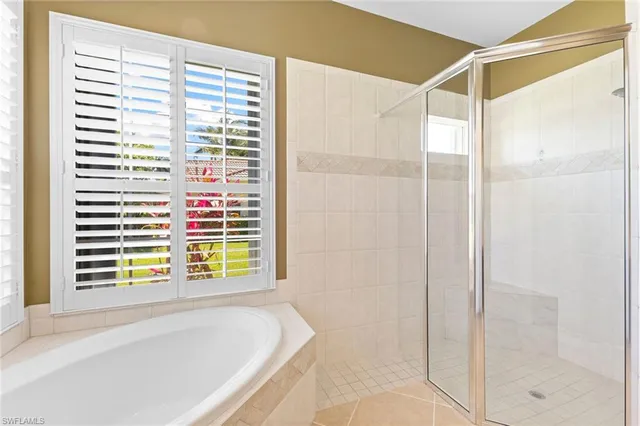a bathroom with a bathtub and a shower