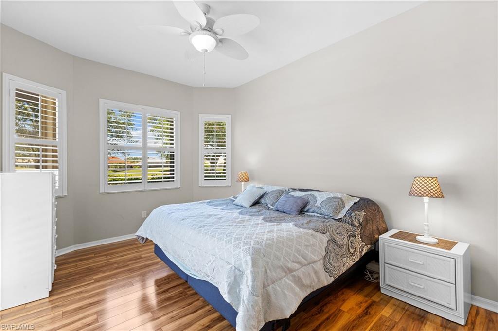 8886 Lely Island Circle Naples, FL 34113 - Photo 37 of 44 a bedroom with a bed and window