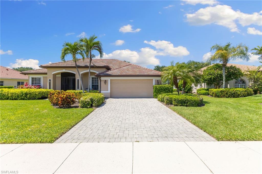 8886 Lely Island Circle Naples, FL 34113 - Photo 44 of 44 front view of a house with a yard
