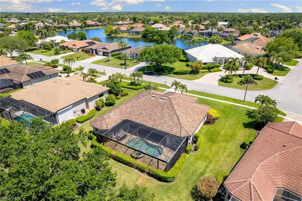 an aerial view of a house with a swimming pool yard and outdoor seating