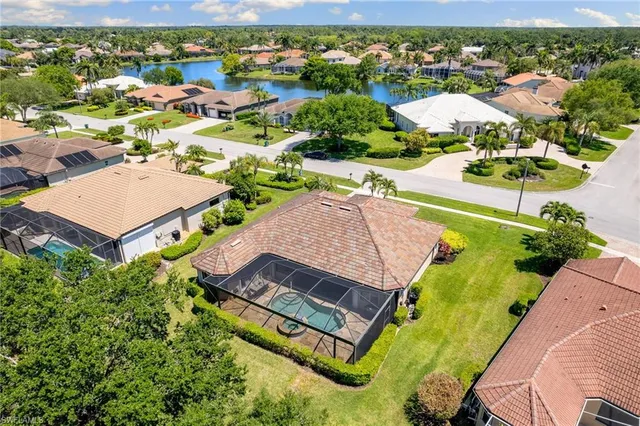 an aerial view of a house with a swimming pool yard and outdoor seating