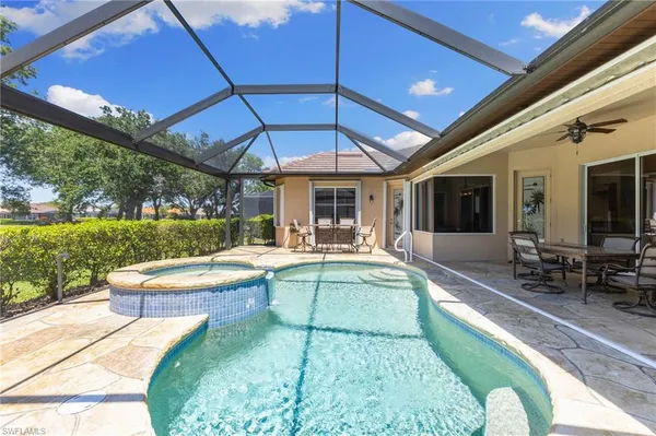 a view of a swimming pool with a patio
