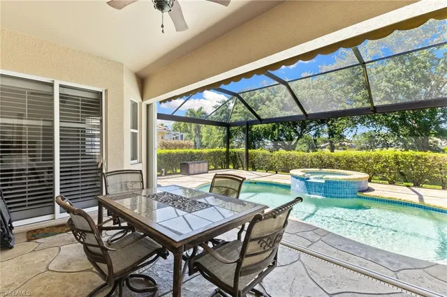 a view of an outdoor dining space with a table and chairs